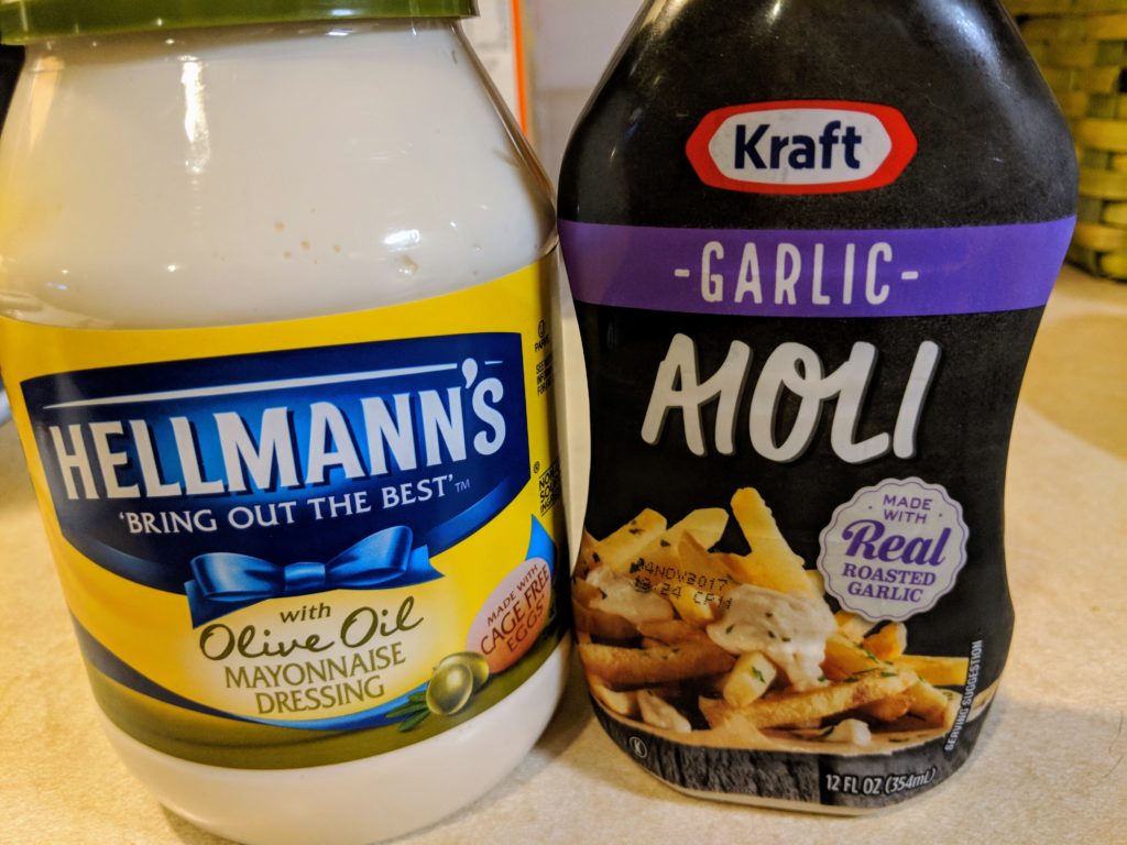 Hellmann's olive oil mayonnaise next to Kraft's garlic aioli